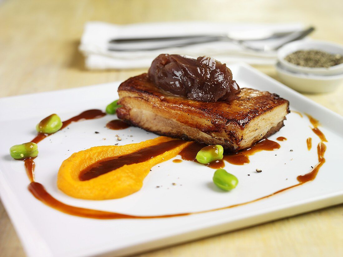 Belly pork with onions, carrot puree and soya beans