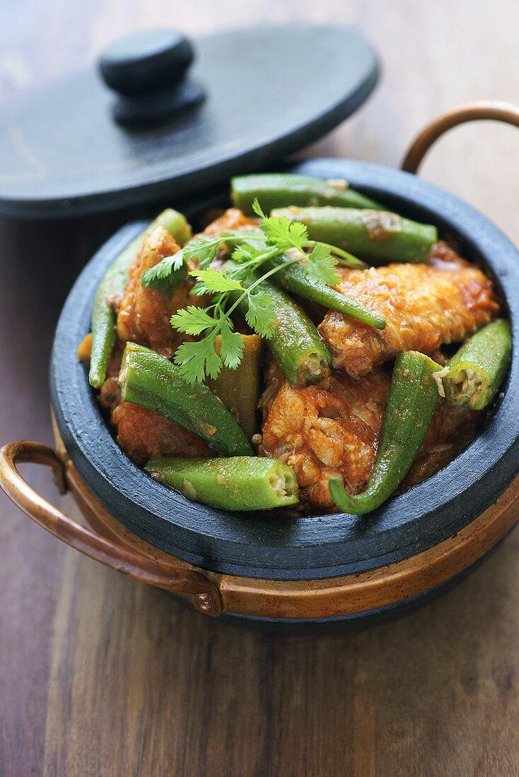 Frango com quiabo (chicken with okra, Brazil) in soapstone dish