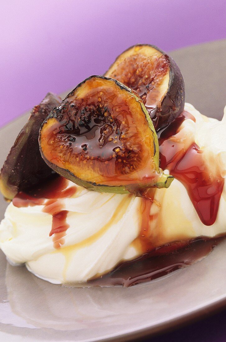 Poached figs with fruit sauce and cream