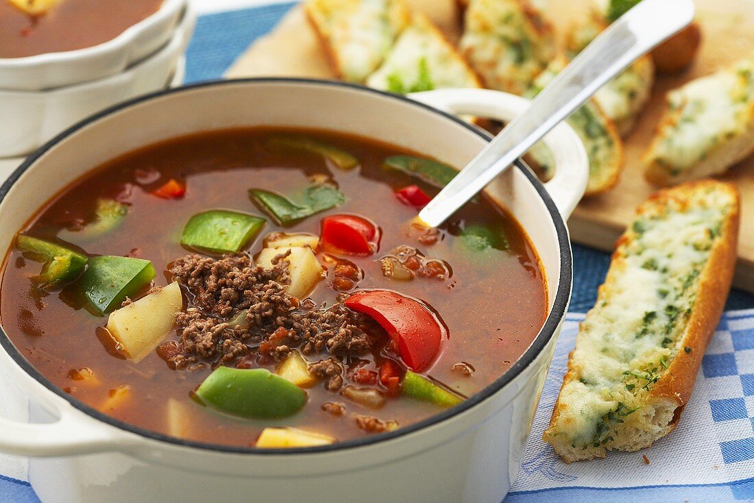 Goulash soup and baguette with toasted mozzarella