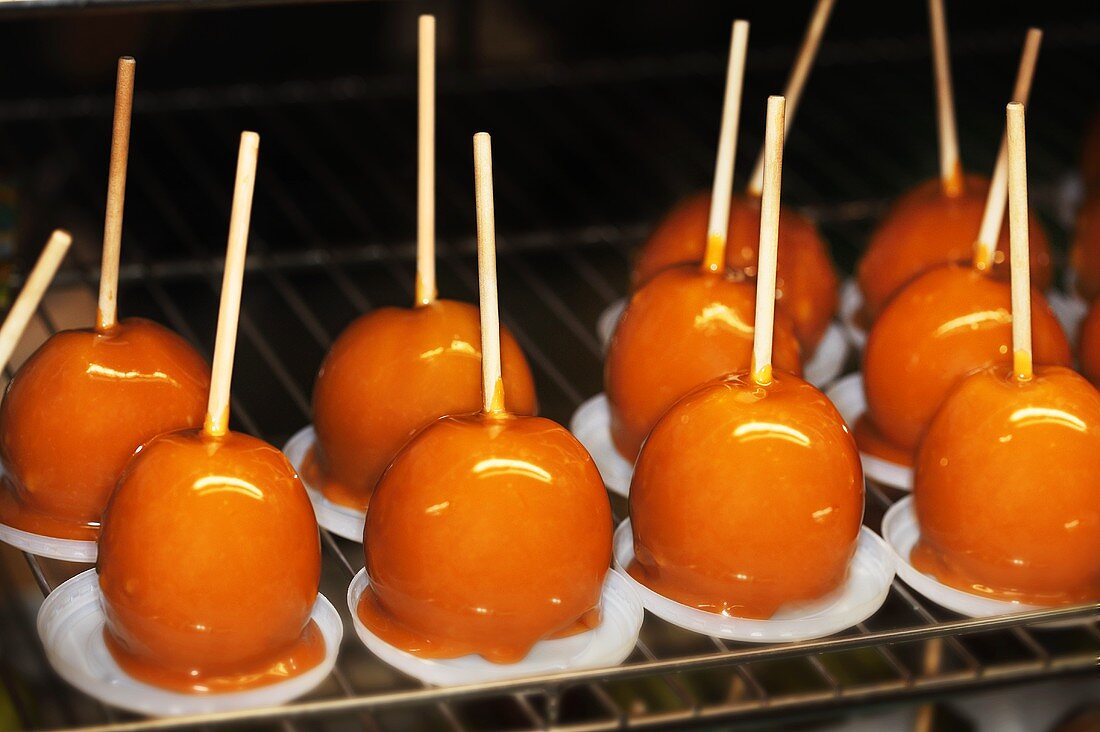 Toffee apples on a rack
