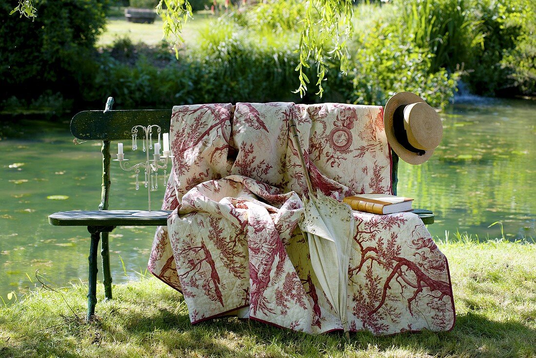 Romantic garden seat by pond