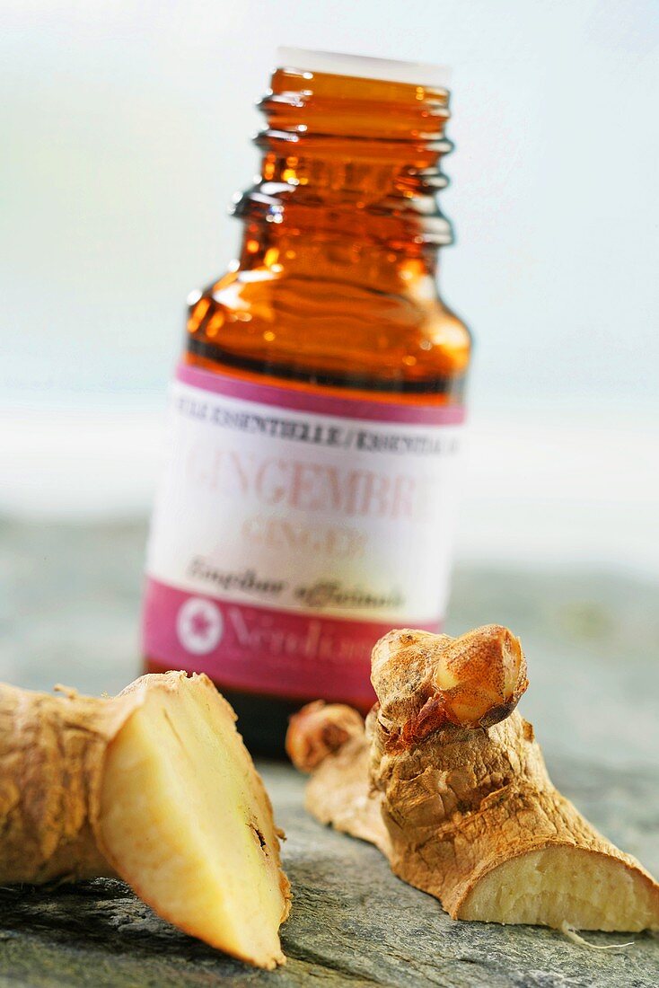 Ginger root and small bottle of ginger oil