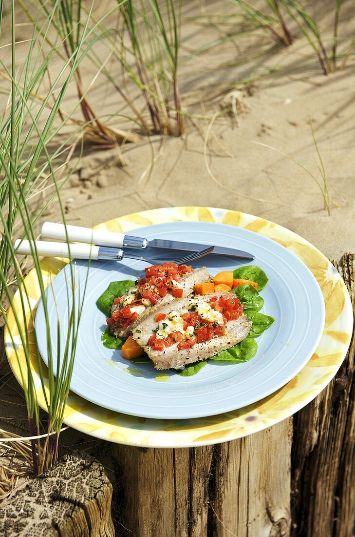 Baked sardines with cheese and tomato stuffing