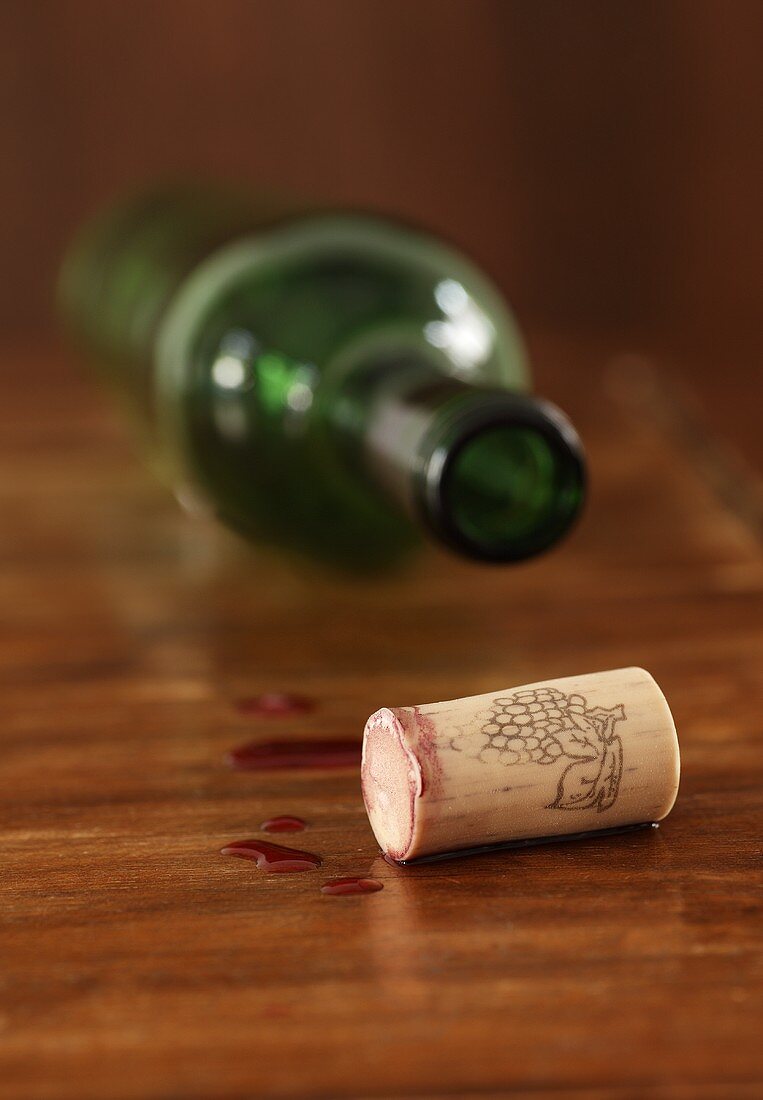 Wine cork and empty wine bottle