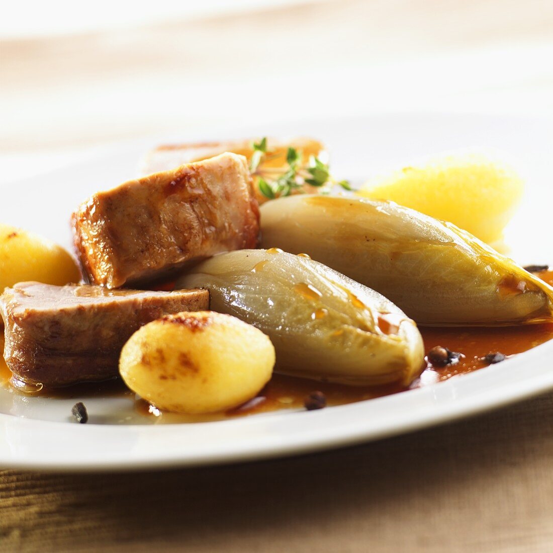 Veal medallions with chicory and boiled potatoes