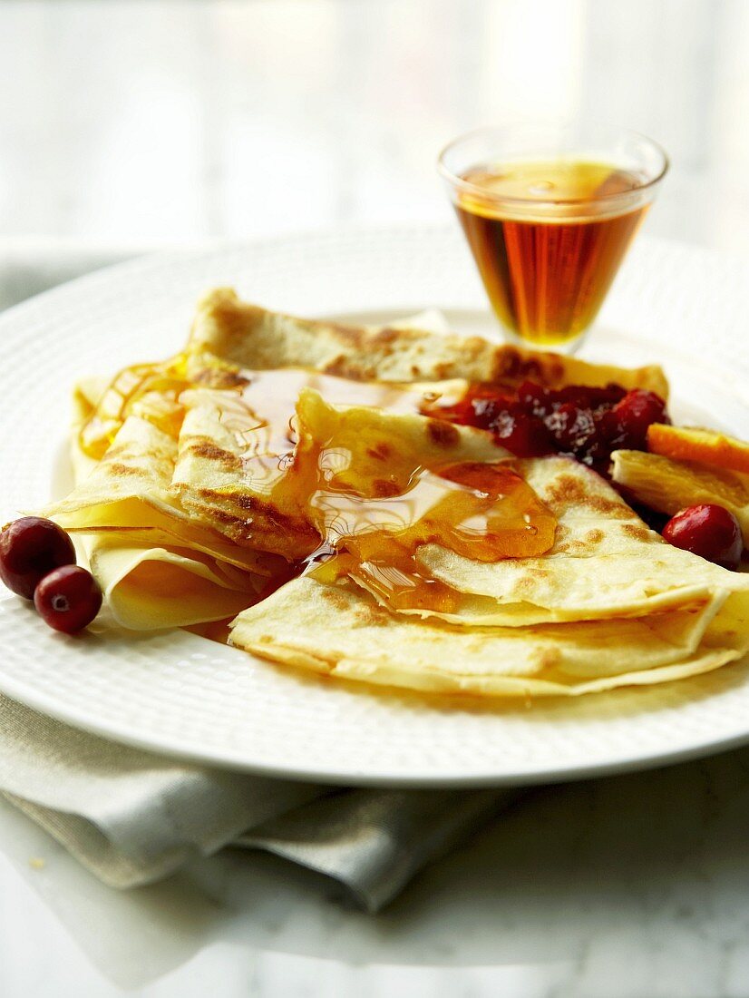 Crêpes with cranberries and maple syrup