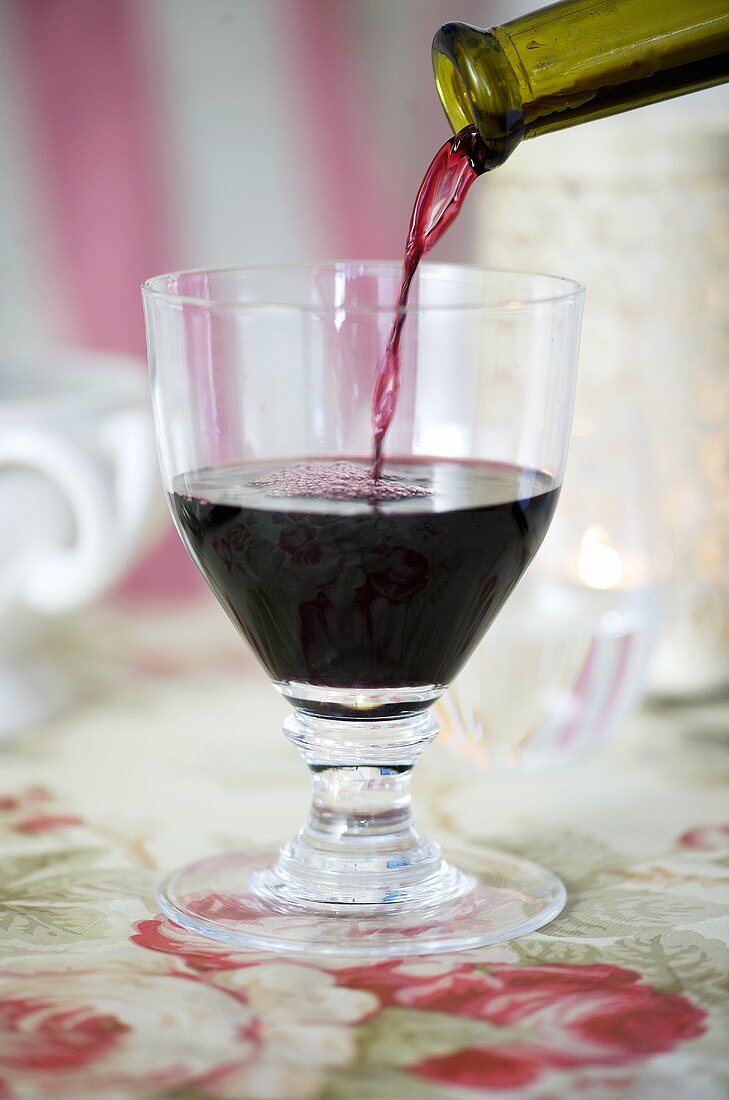 Pouring a glass of red wine