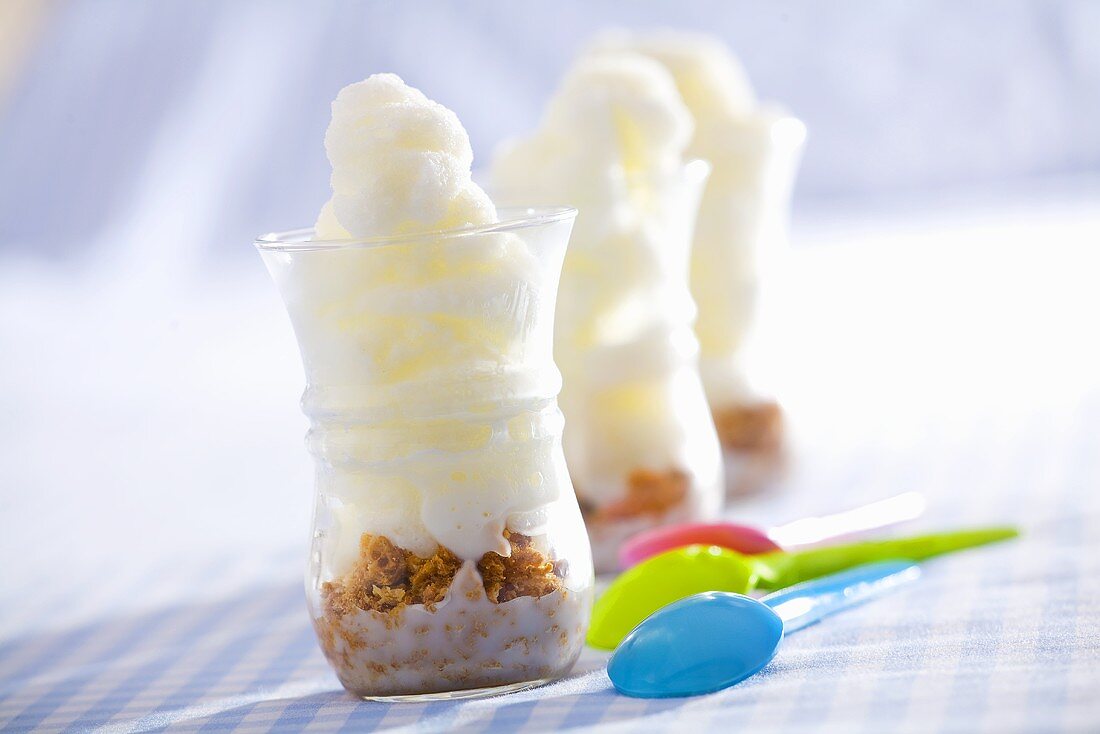 Three glasses of yoghurt ice cream with amaretti