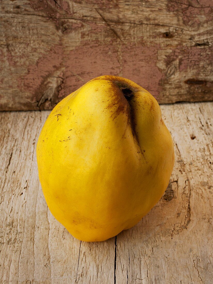 A quince on a wooden background