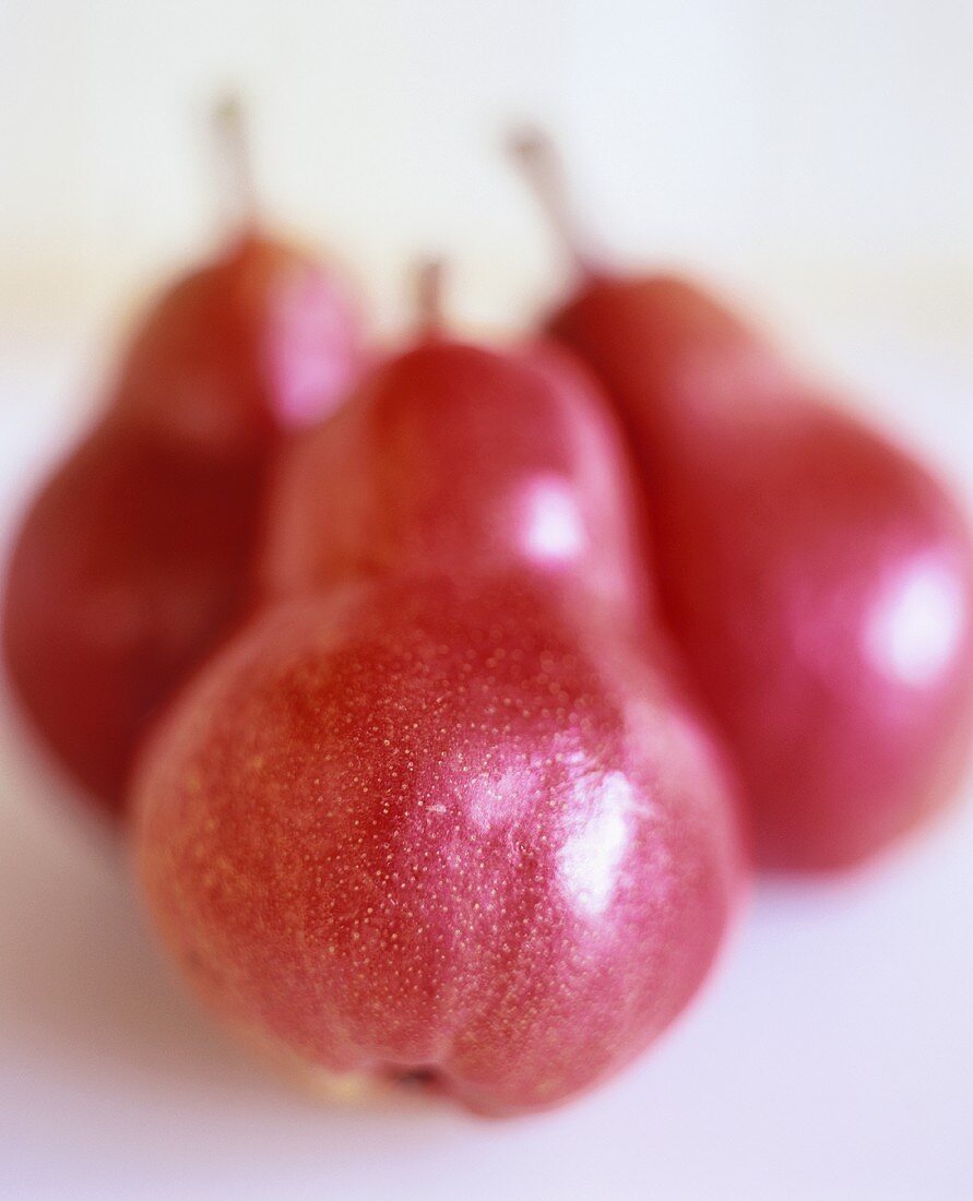 Three red organic pears
