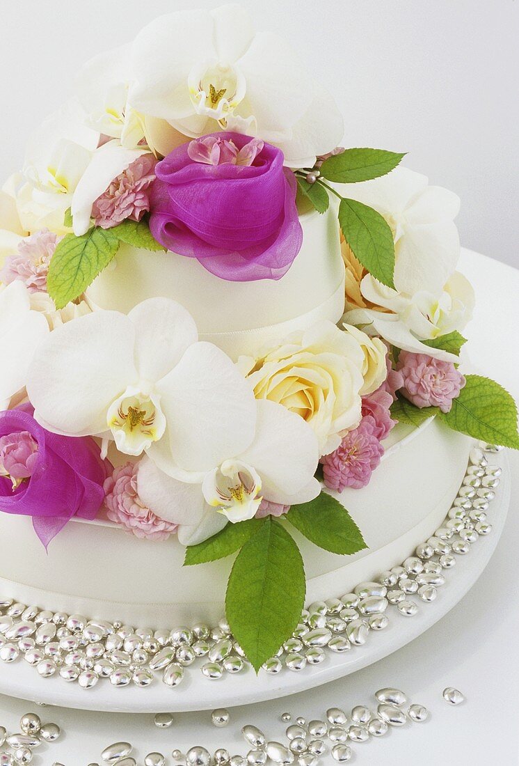Wedding cake with roses and orchids
