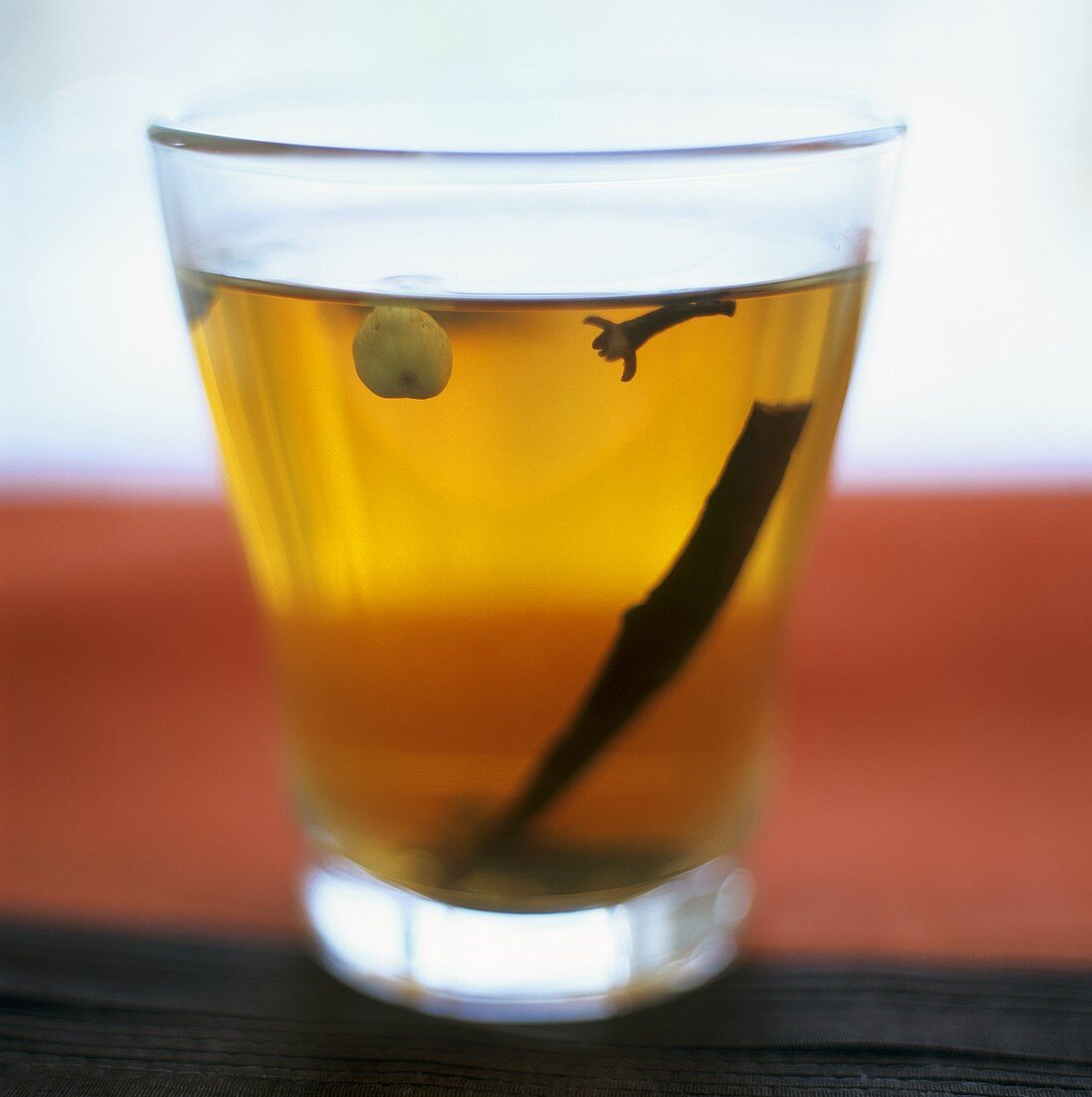 A glass of tea with spices