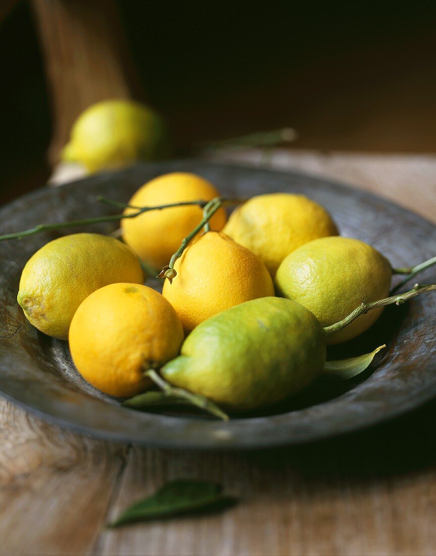 Several lemons in a dish