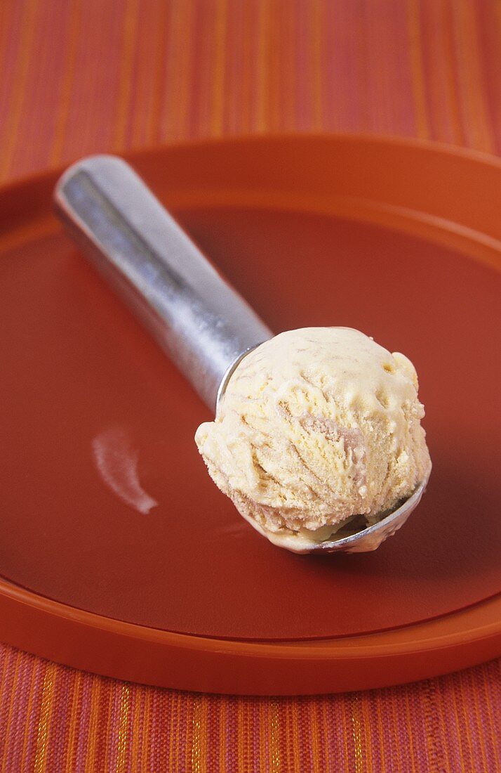 A scoop of strawberry and vanilla ice cream