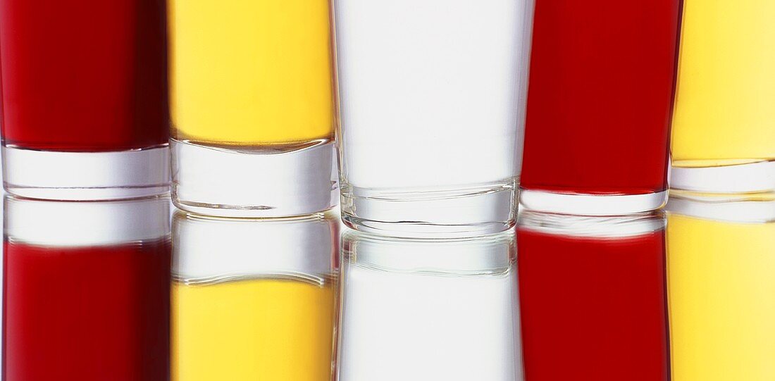 Coloured drinks on a mirror