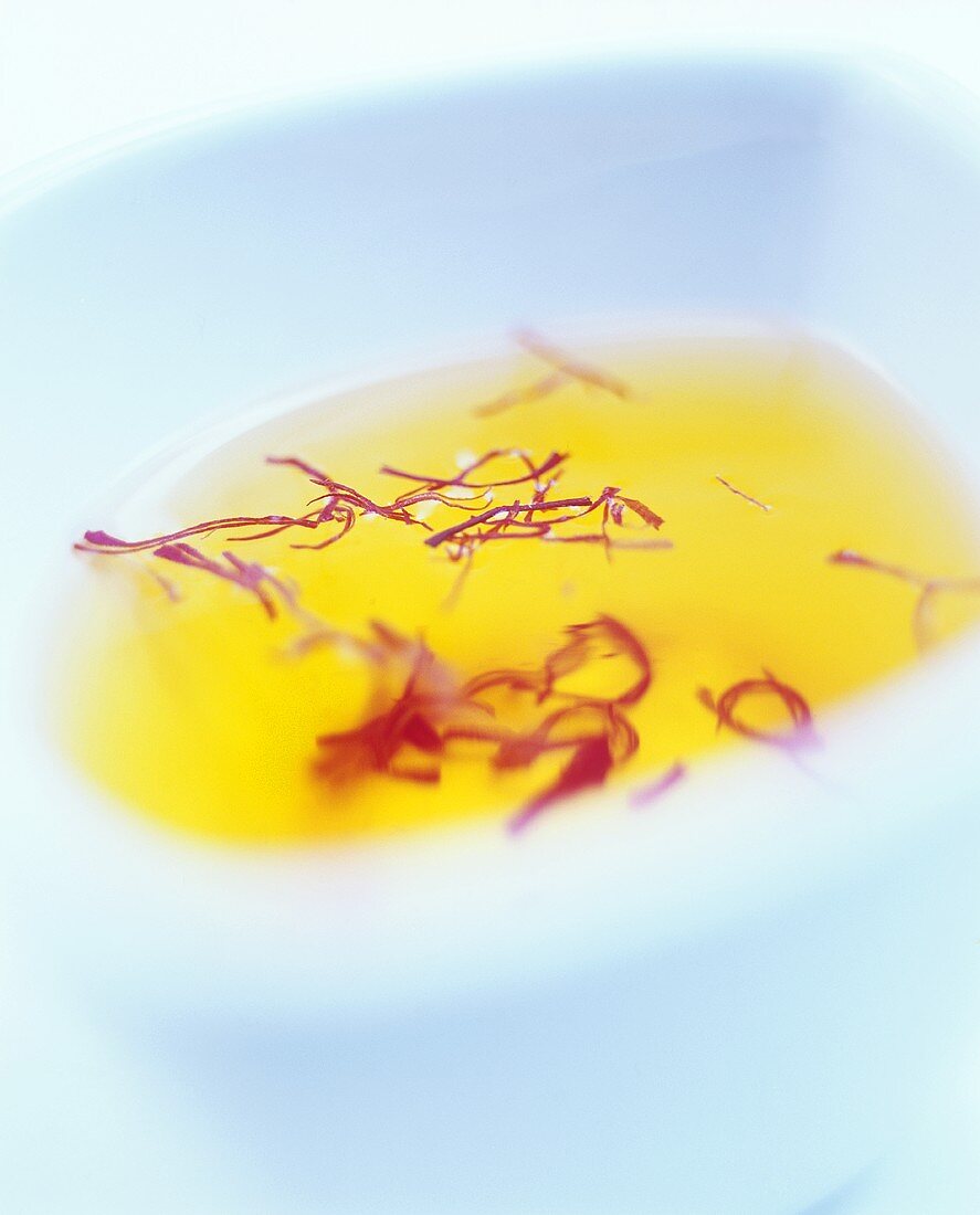 Saffron threads in water