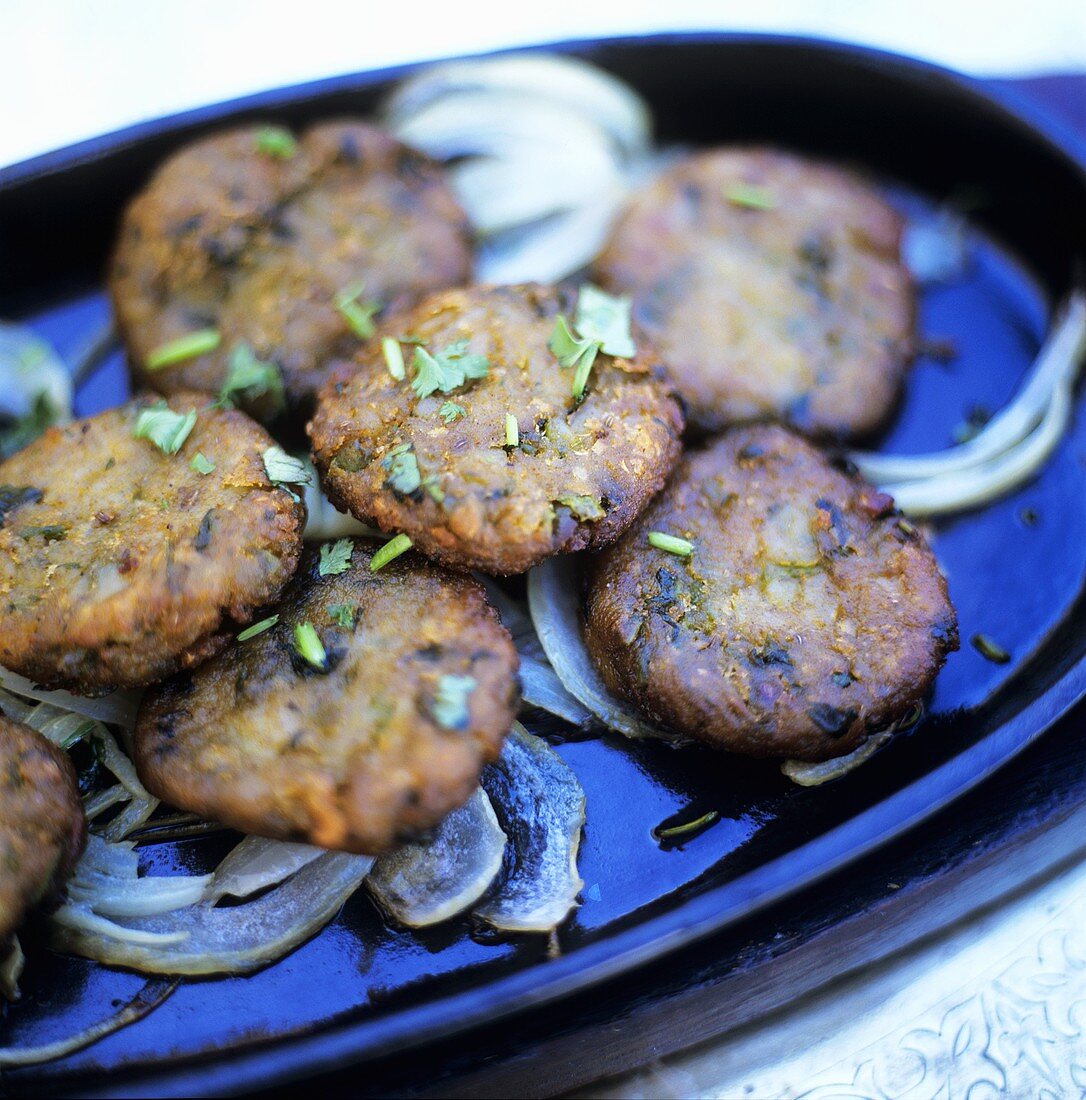 Vegetable burgers with onions and coriander leaves