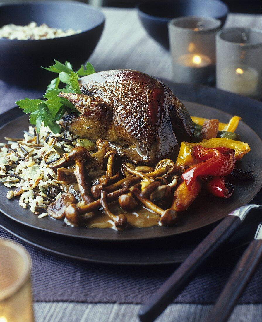 Roast quail with wild rice, mushrooms, peppers