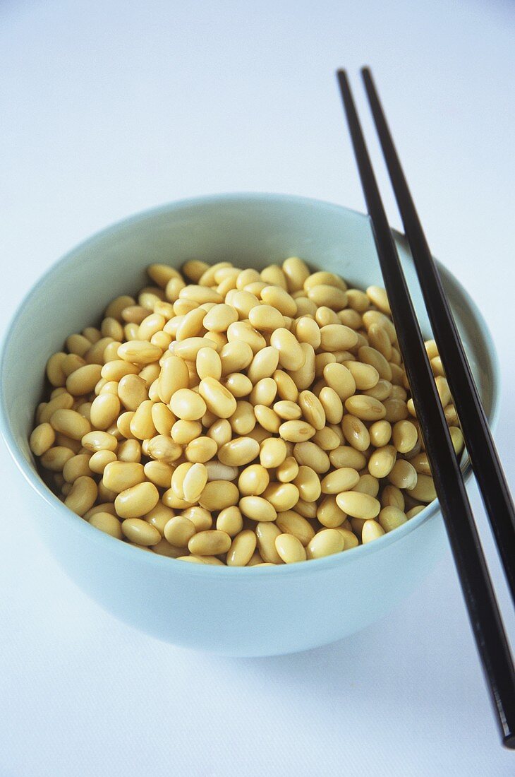 Soya beans in a small bowl with chopsticks