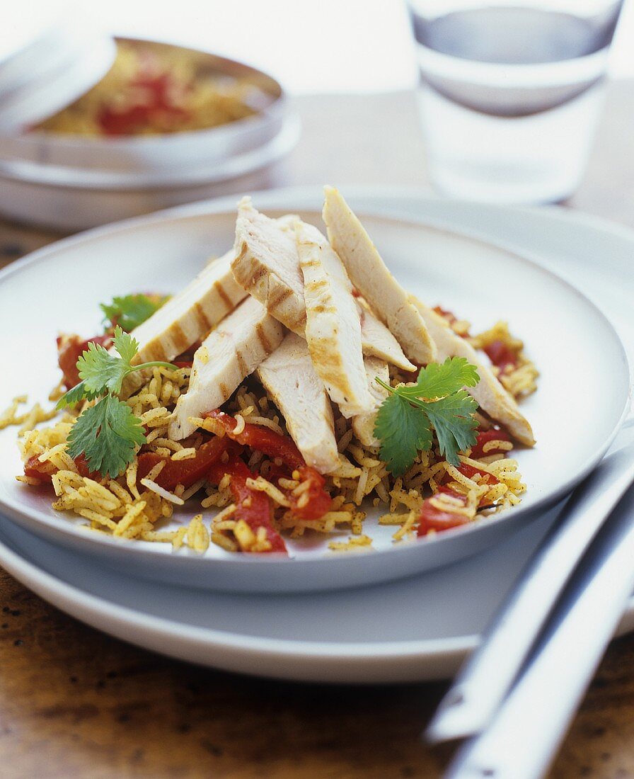 Rice & pepper salad with strips of grilled chicken breast