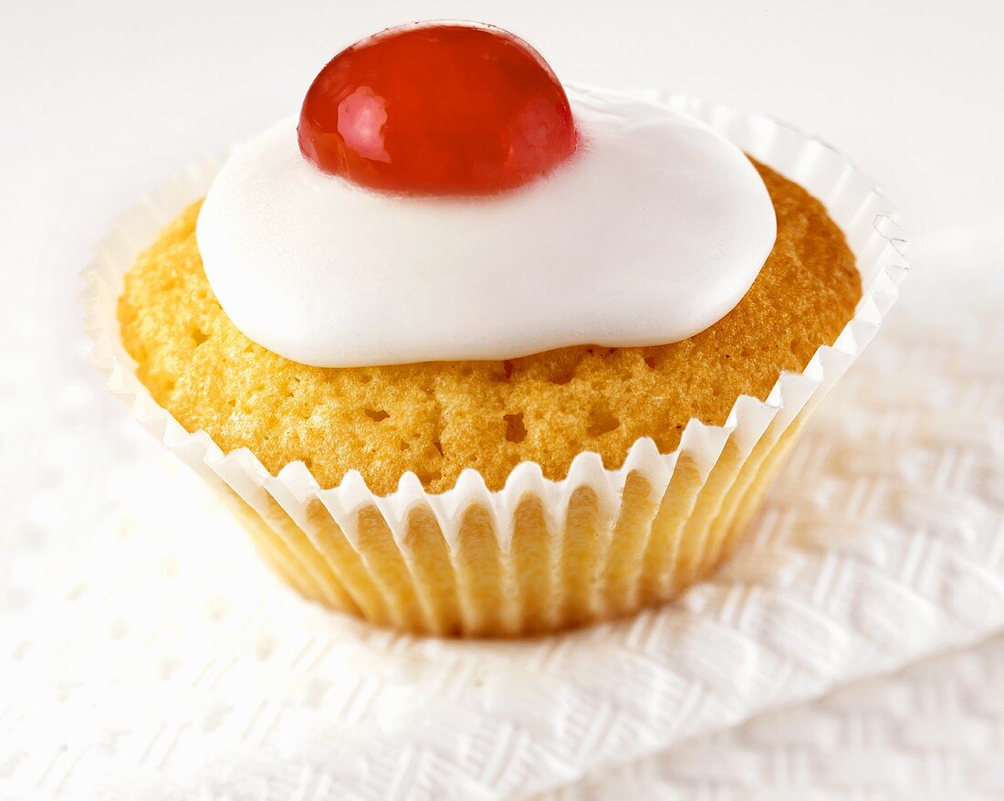 Iced cupcake with cherry
