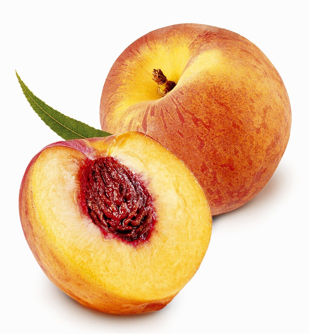 Whole and half peach