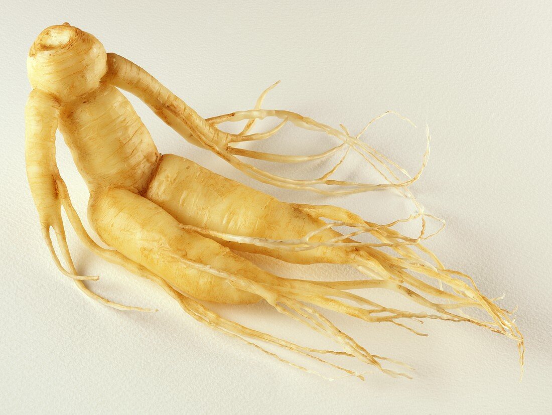 A ginseng root on a light background