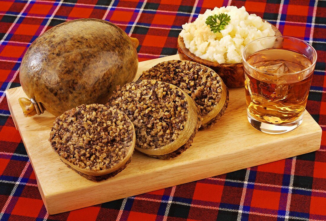 Haggis served with mashed turnips & a glass of whisky (Scotland)