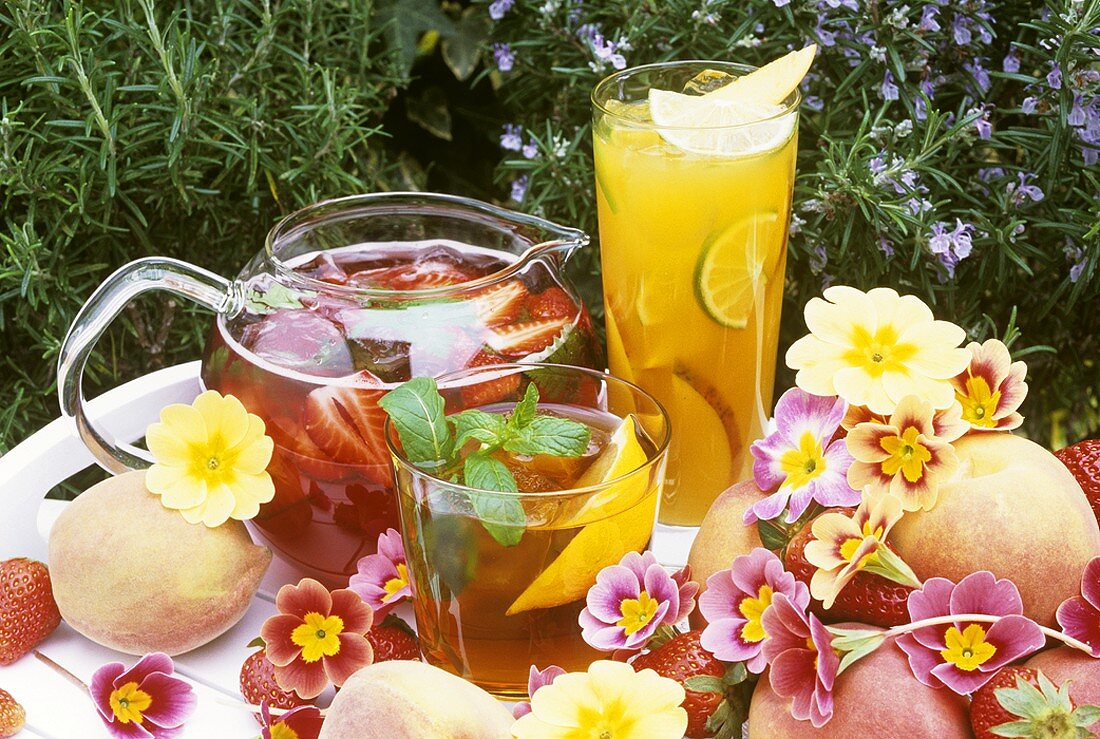 Three different fruit punches on a garden table