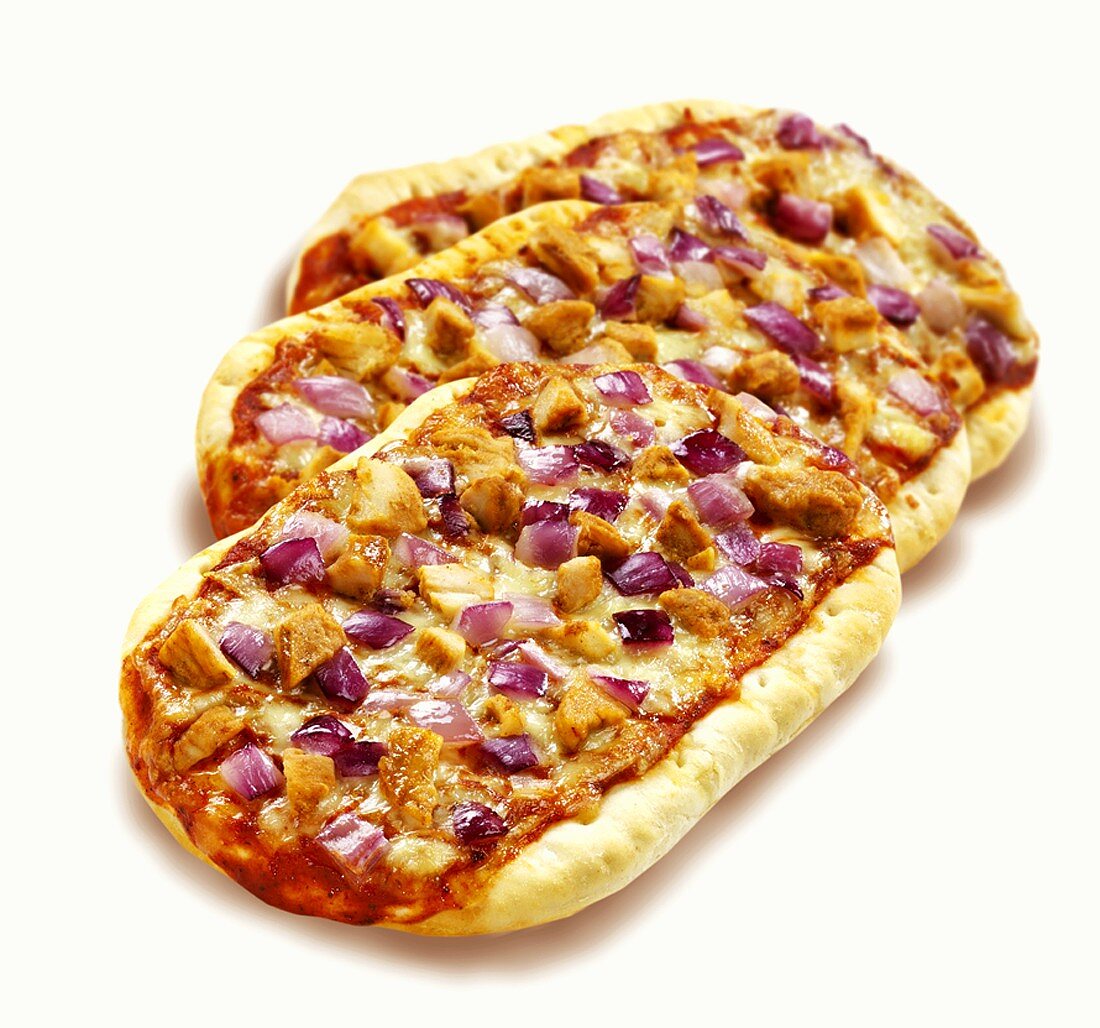 Small chicken and red onion pizzas