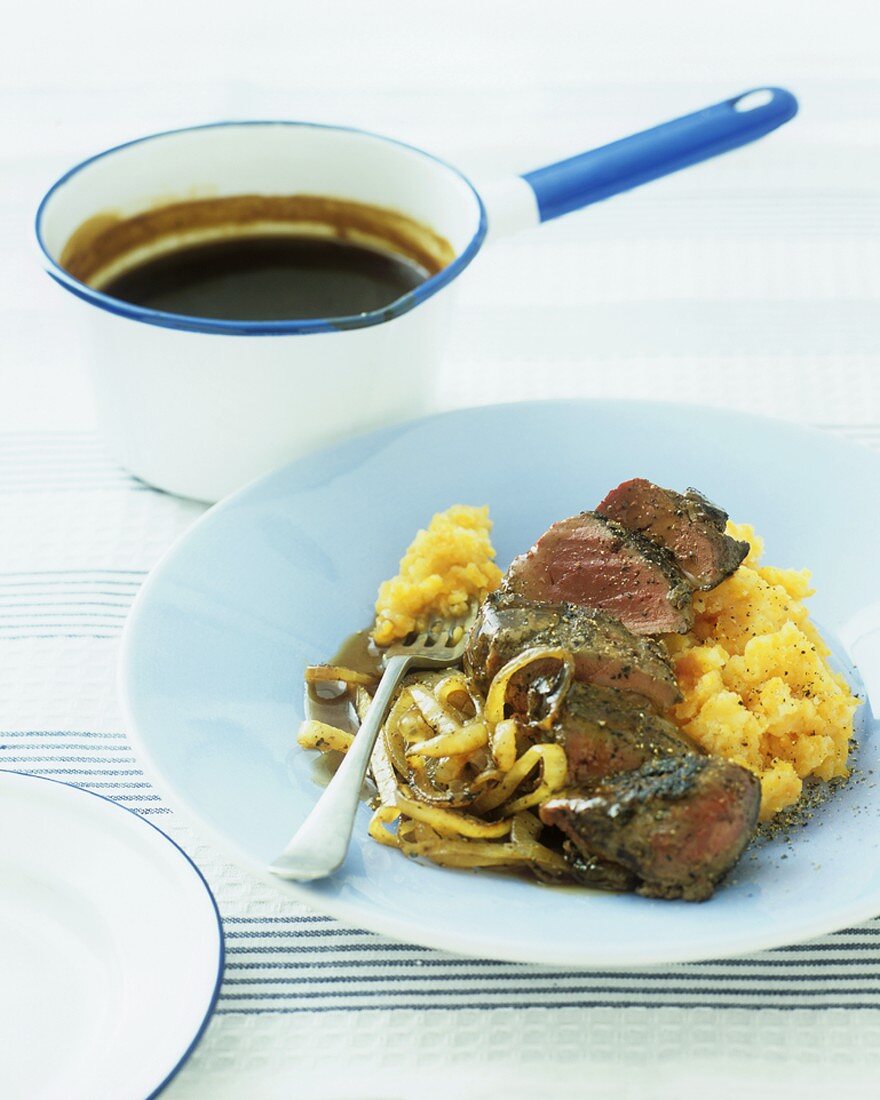 Liver with caramelised onions and mashed root vegetables