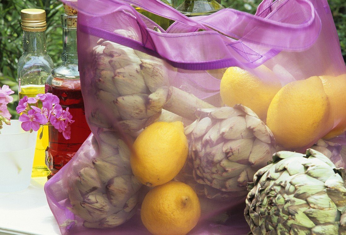 Artichokes and lemons in a shopping bag