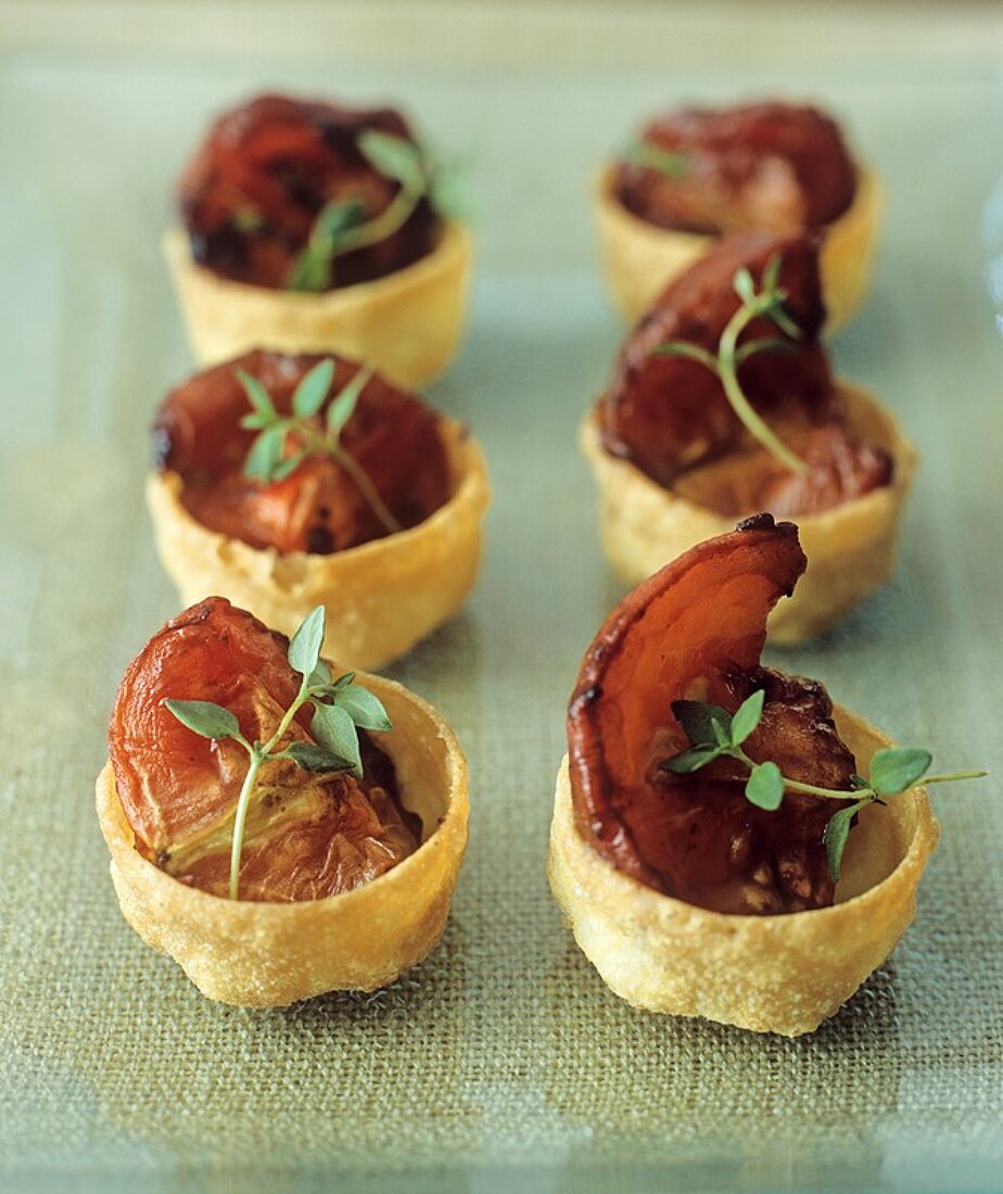 Croustades (small pastry shells) filled with baked tomatoes