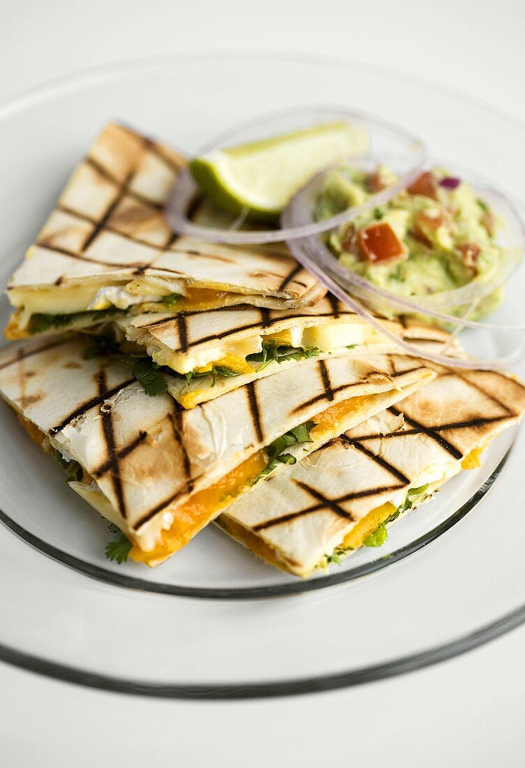 Quesadillas with mango and Brie filling, with guacamole