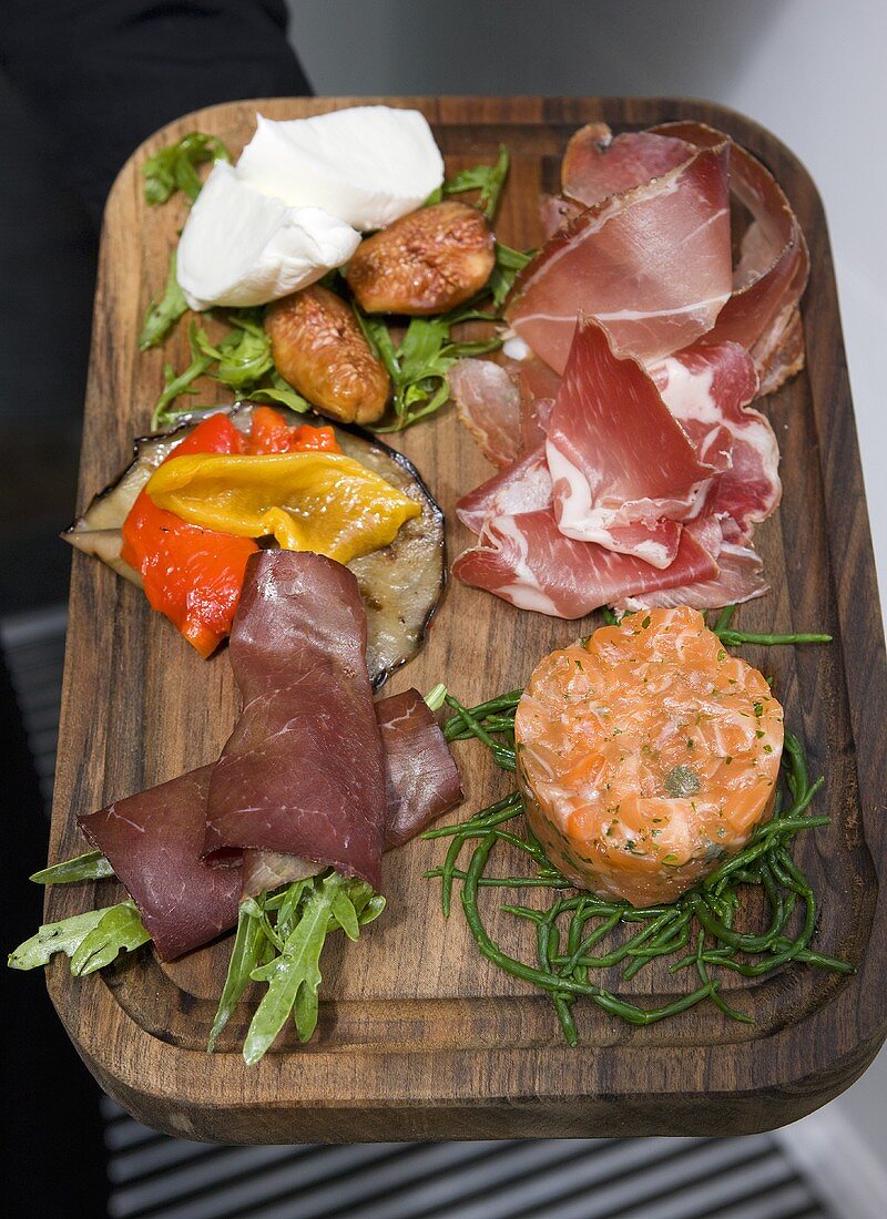 Antipasti: ham, salmon cake and vegetables