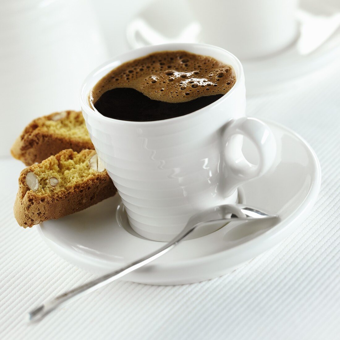A cup of coffee with cantuccini