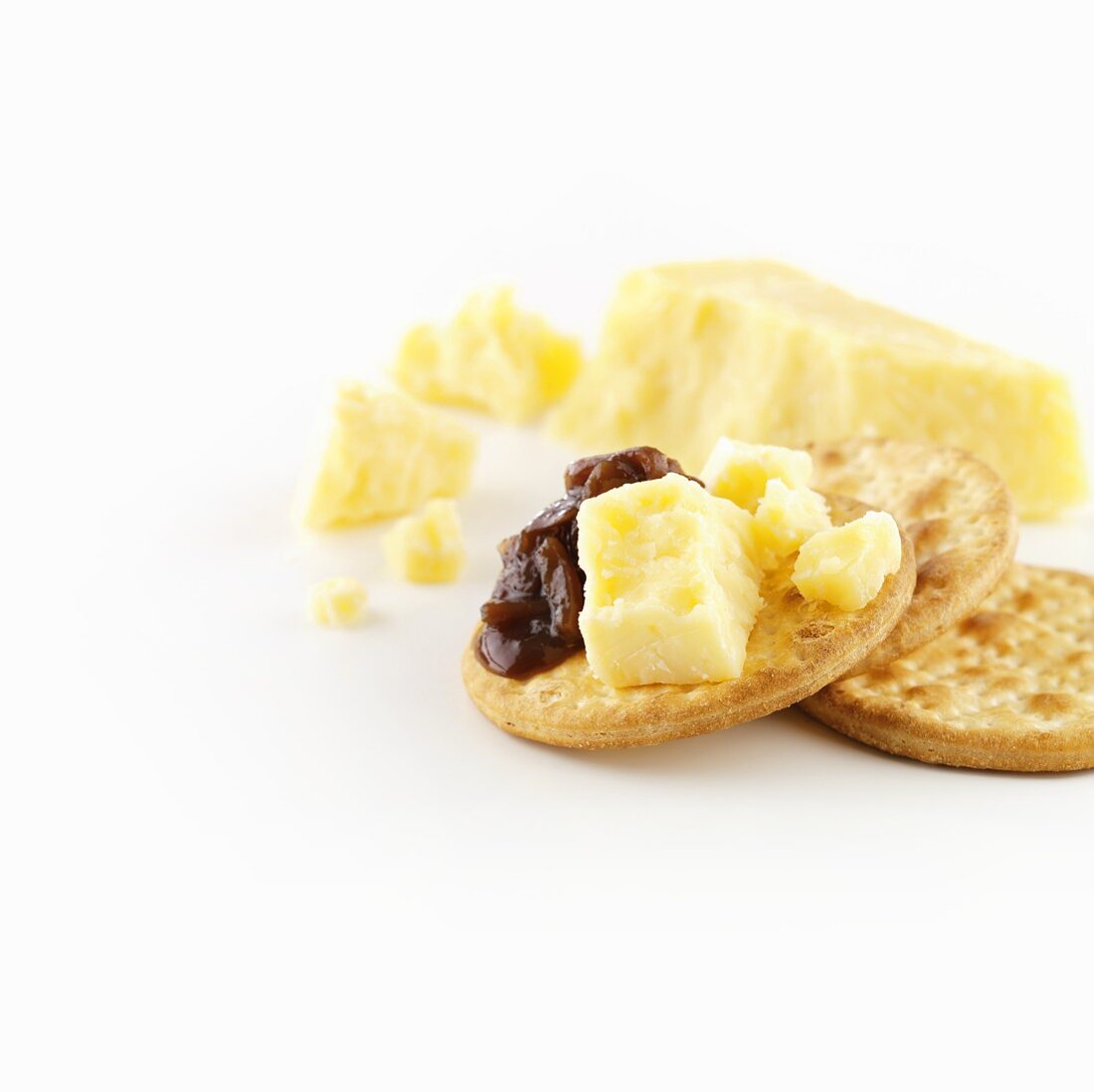 Vintage Cheddar cheese with onion chutney on cracker