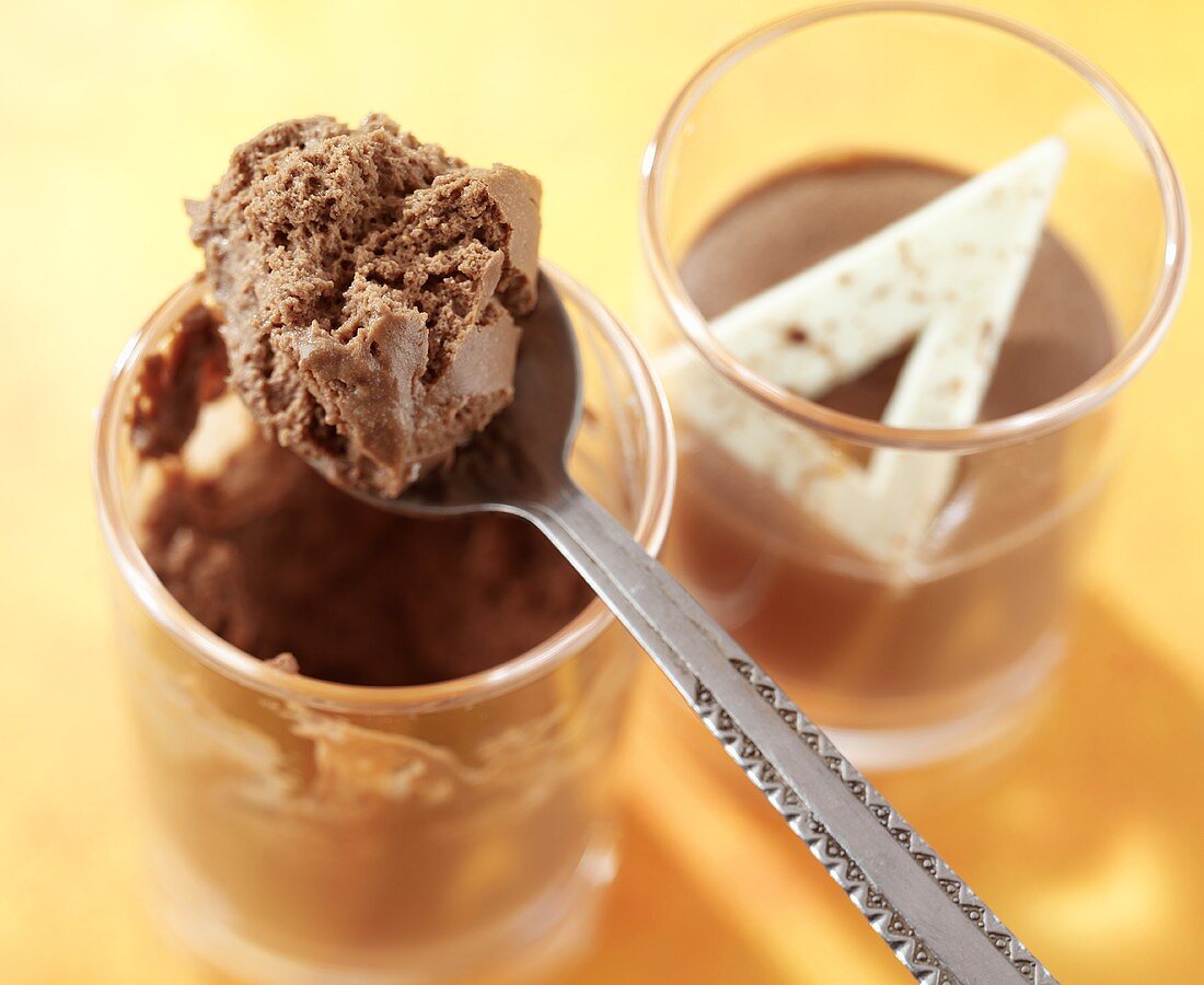 Chocolate mousse in glass and on spoon