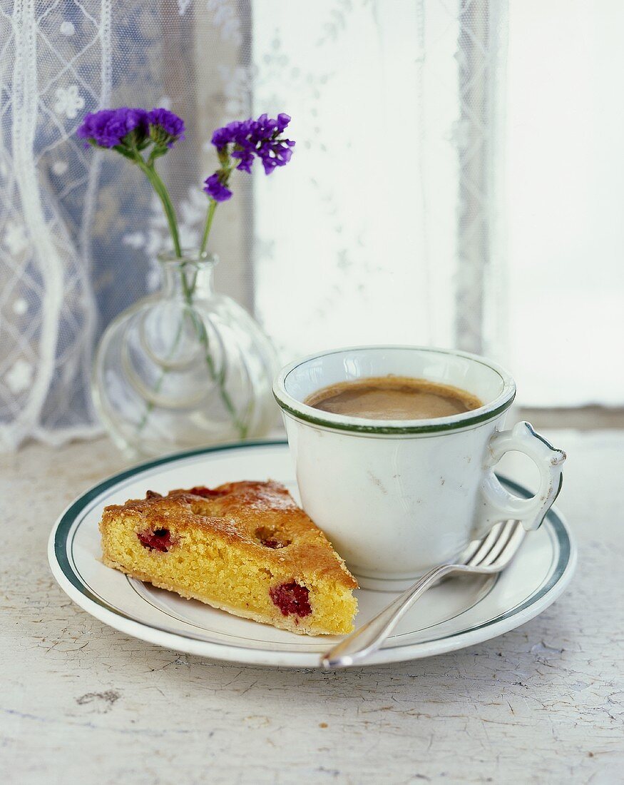 Raspberry almond tart and a cup of coffee