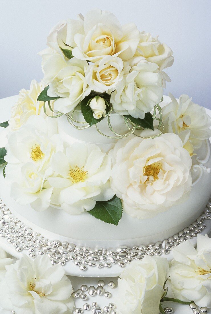 Wedding cake with white roses and silver beads