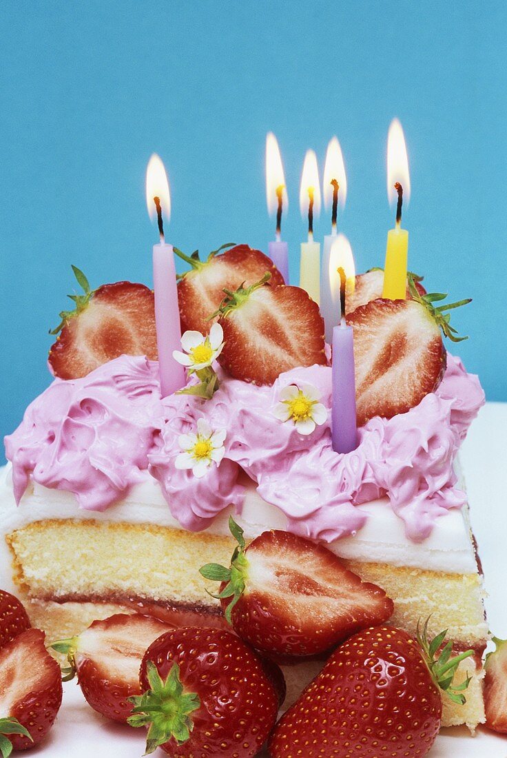 Vanilla strawberry cake with birthday candles