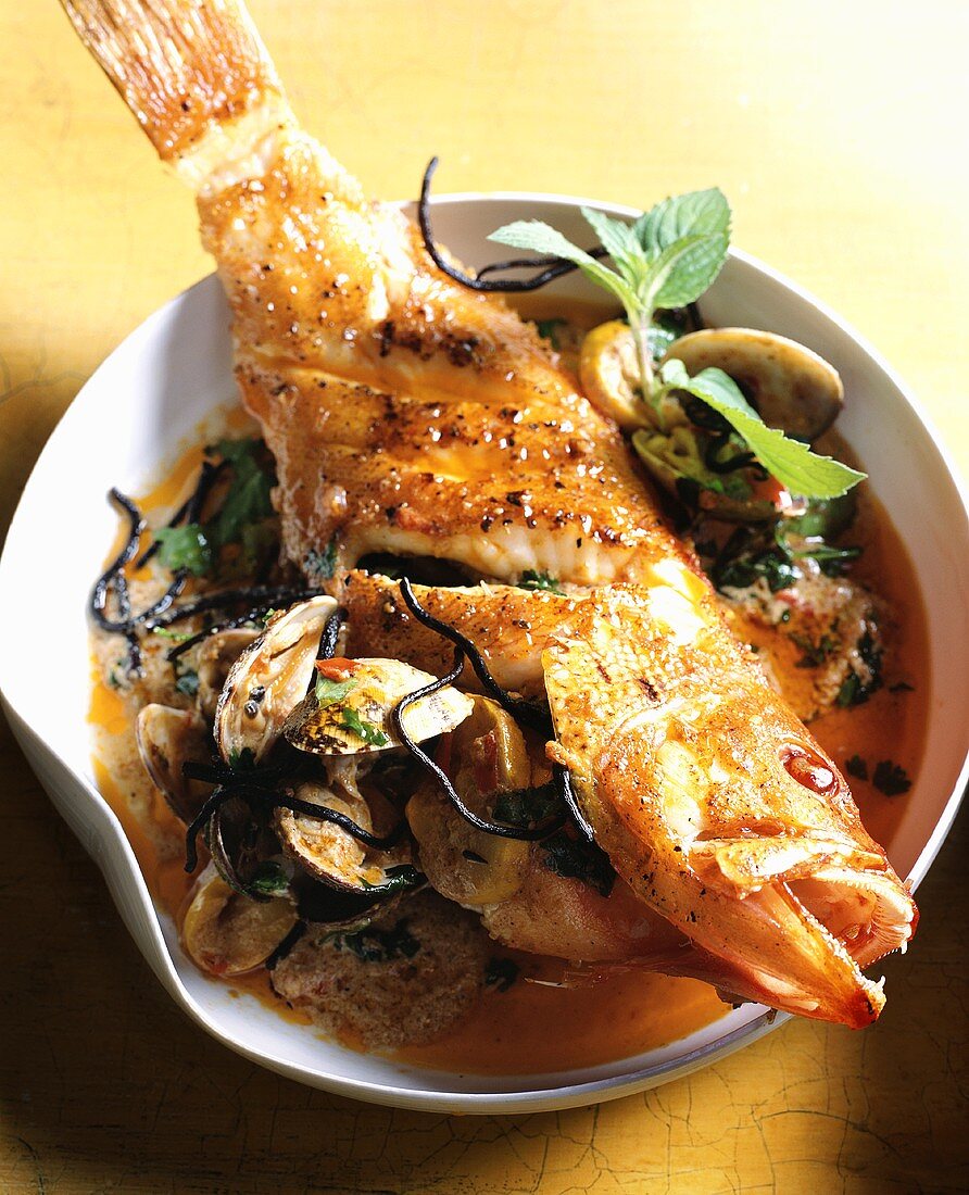 Fried red snapper on Thai soup
