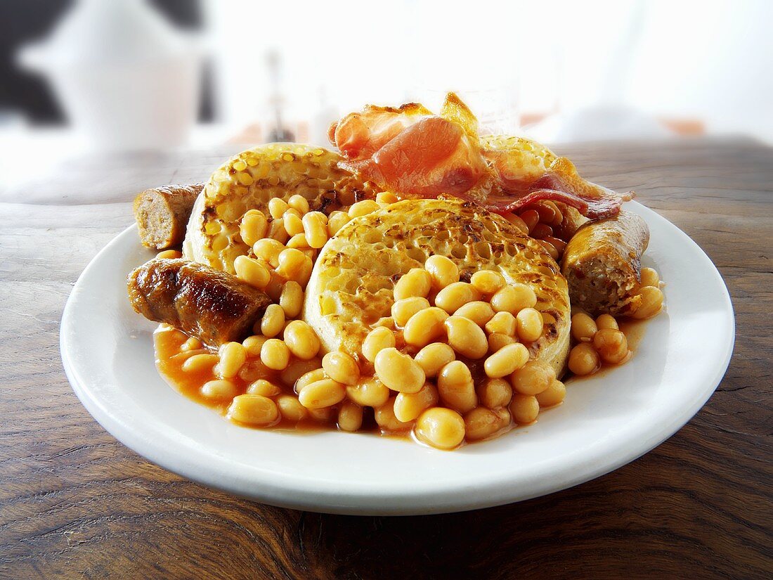 English breakfast: crumpets, sausages and baked beans