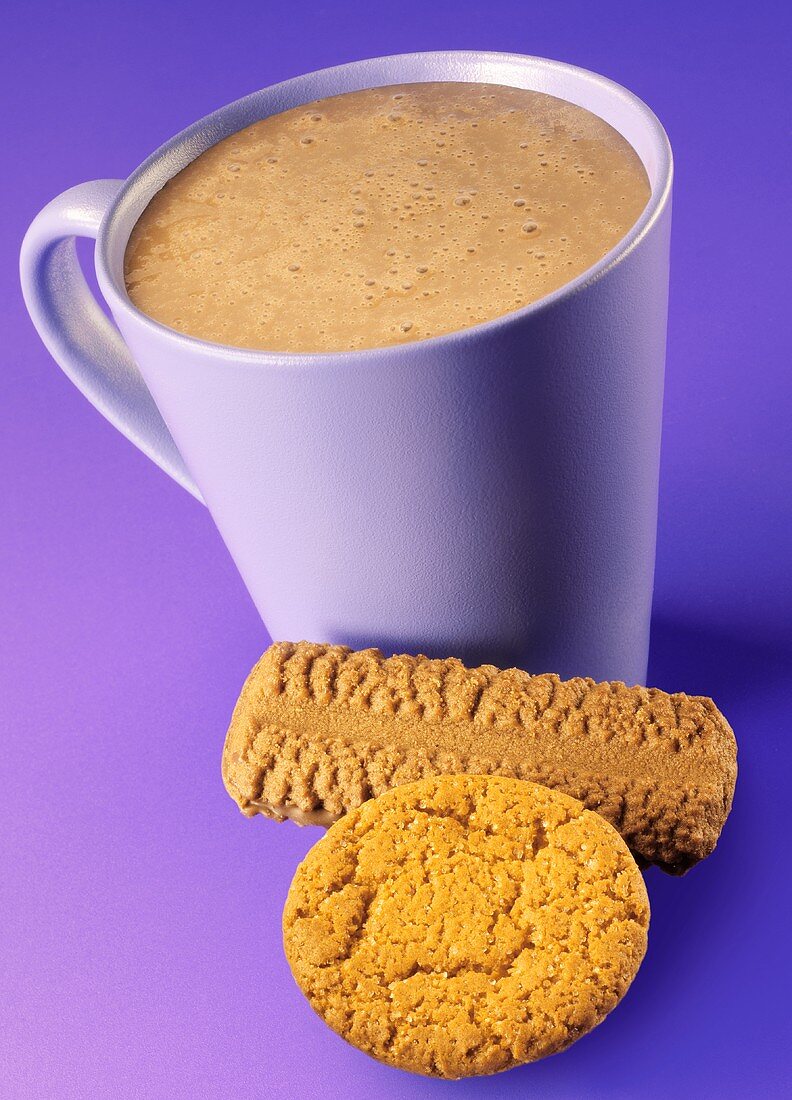 A mug of hot chocolate with biscuits