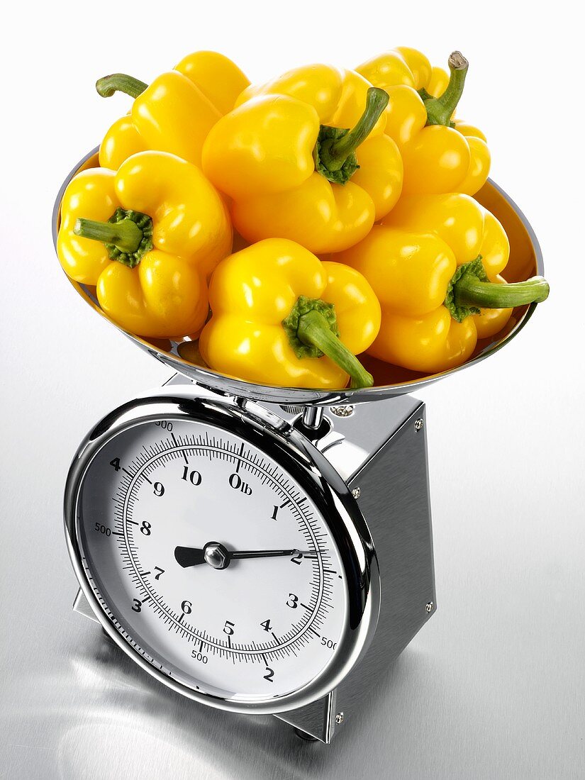Yellow peppers on kitchen scales