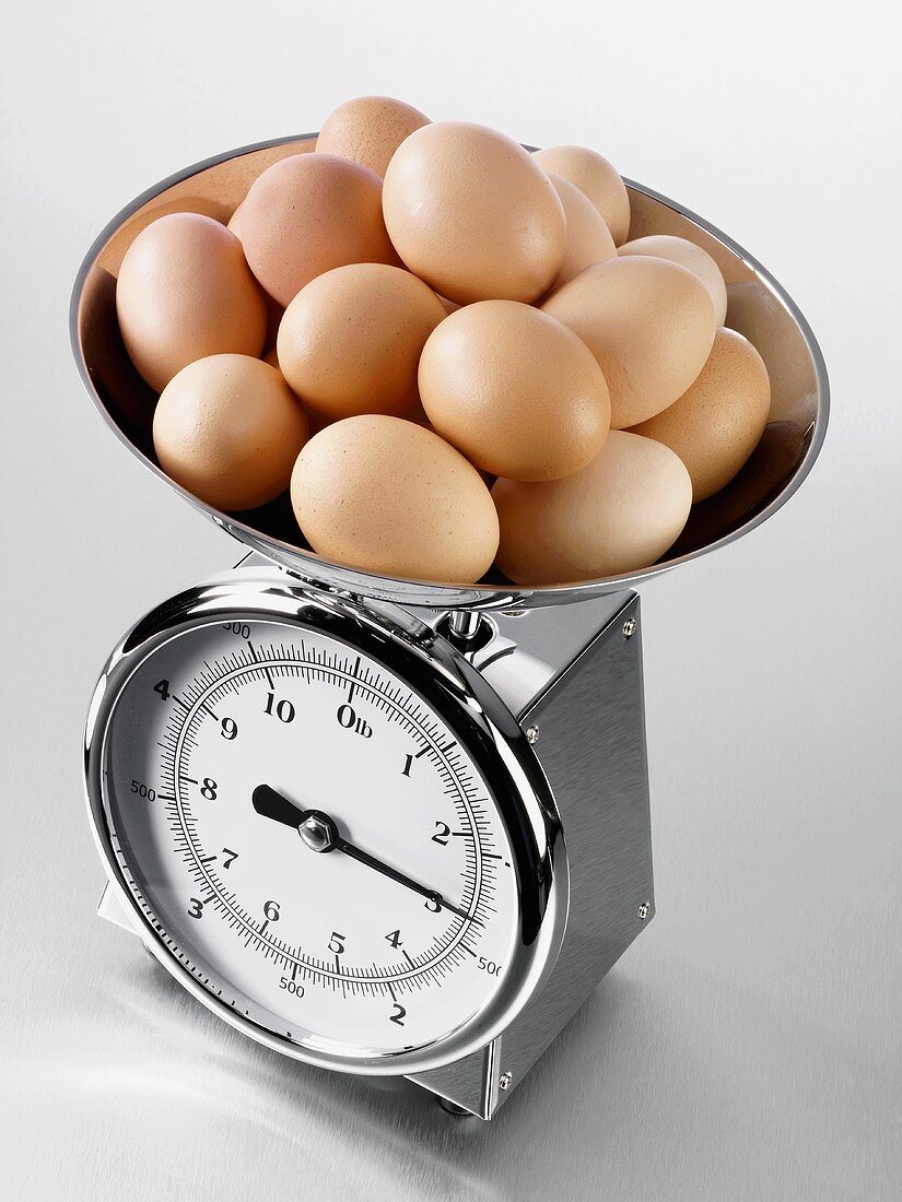 Brown eggs on kitchen scales