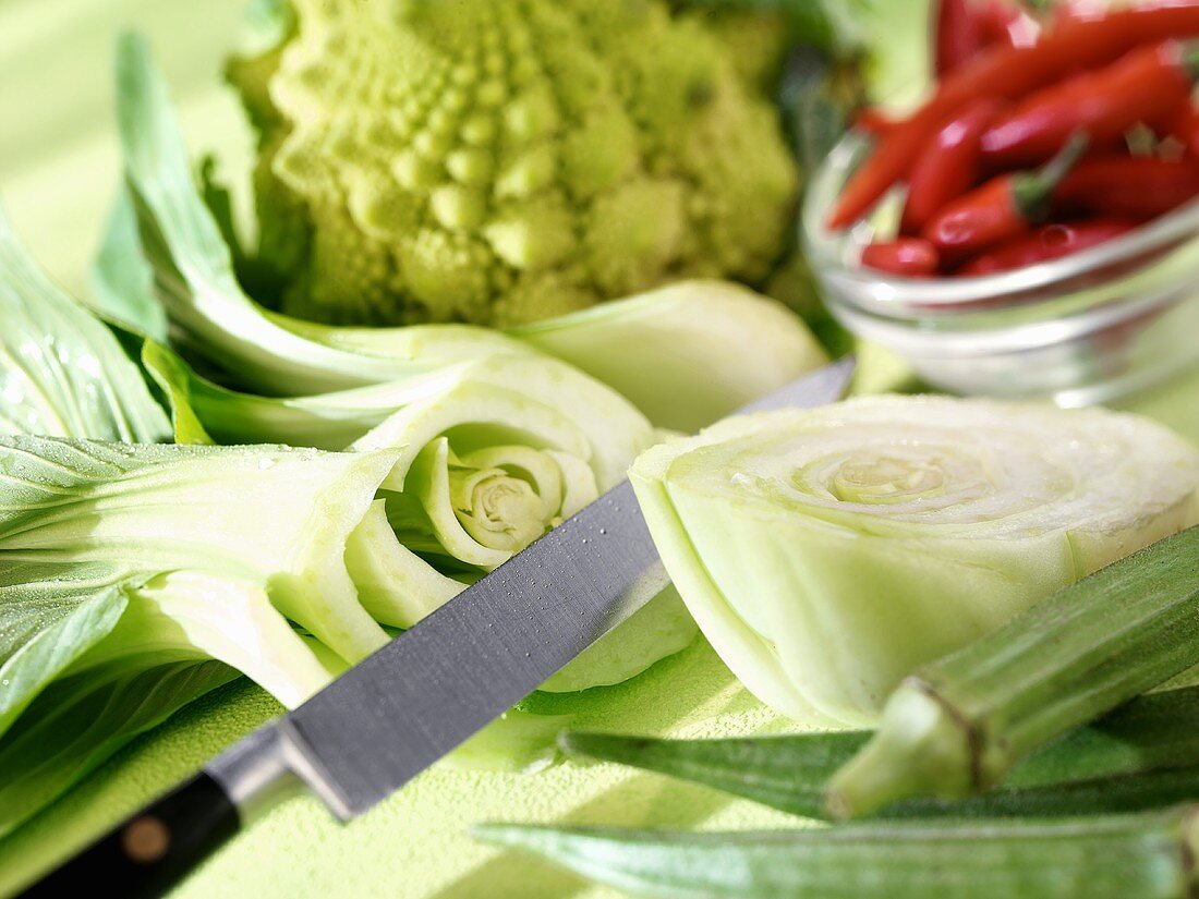 Halved pak choi among assorted vegetables