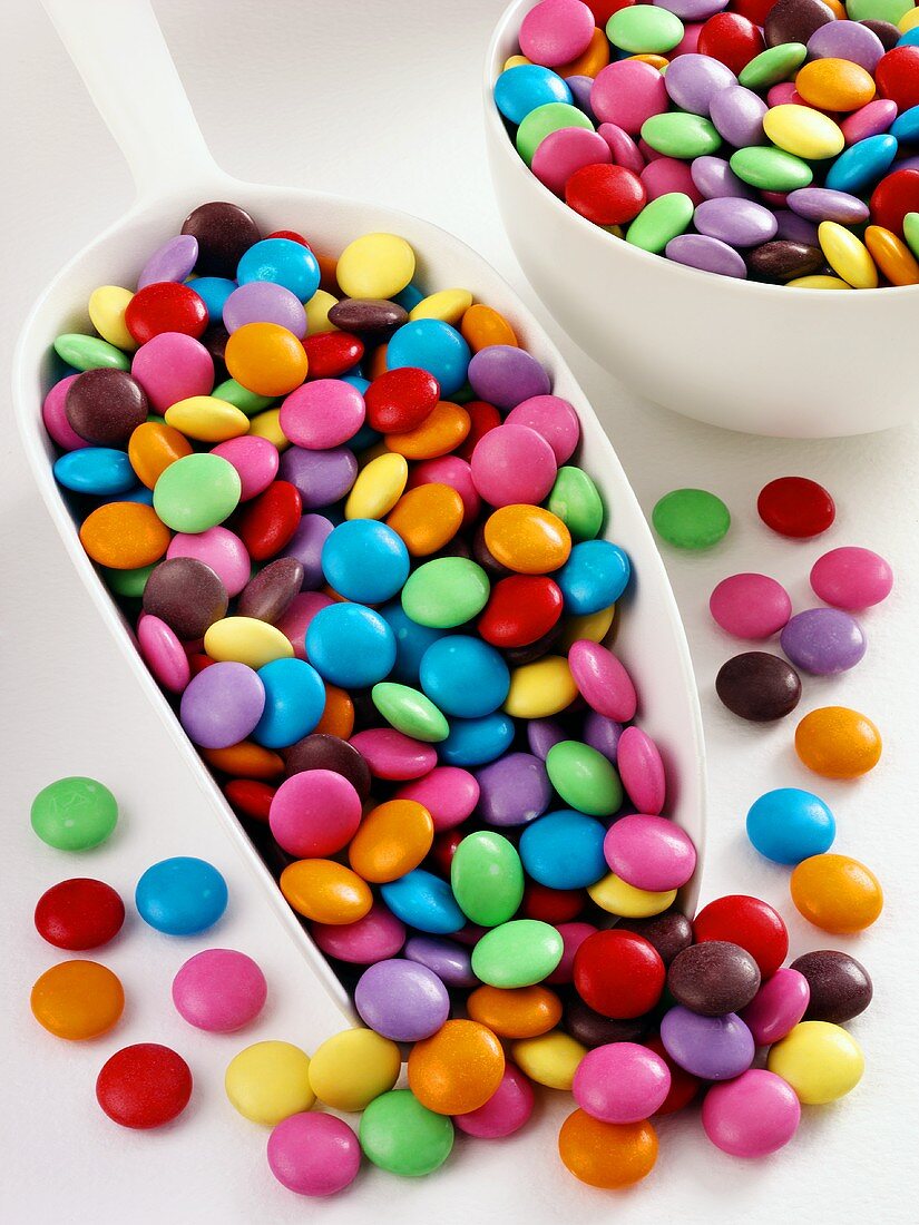 Smarties in scoop and small bowl
