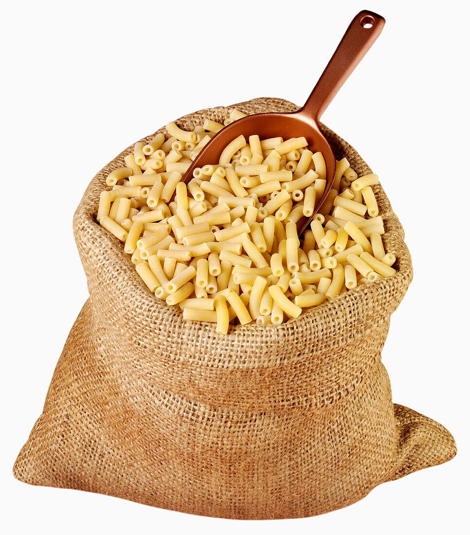 Macaroni in jute sack with scoop
